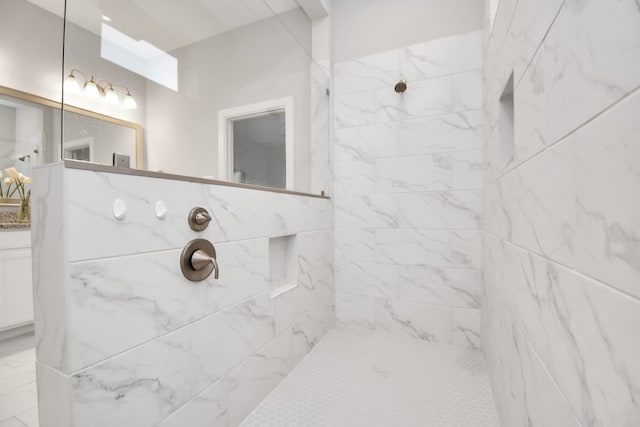 bathroom with a tile shower