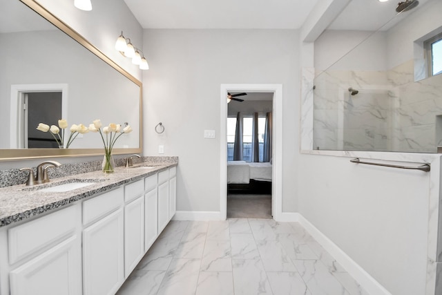 bathroom featuring a tile shower, vanity, and ceiling fan