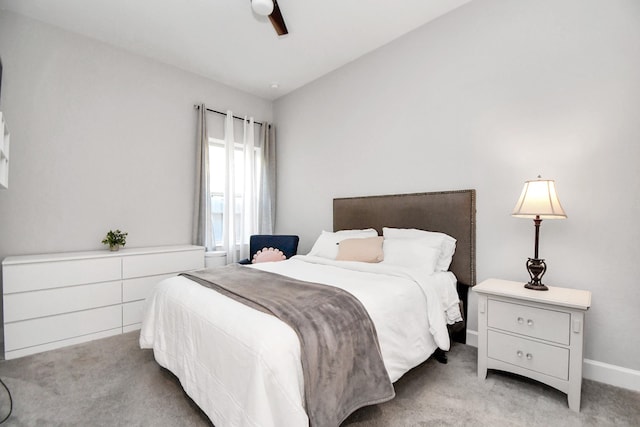 bedroom with light carpet, ceiling fan, and lofted ceiling