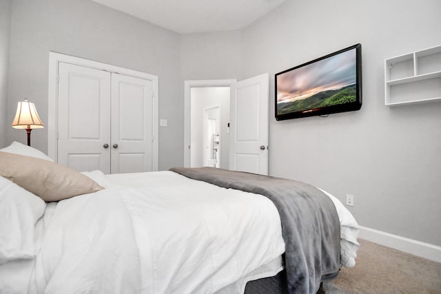 bedroom featuring a closet and carpet floors