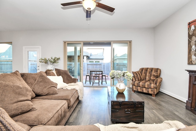 living room with hardwood / wood-style flooring and ceiling fan