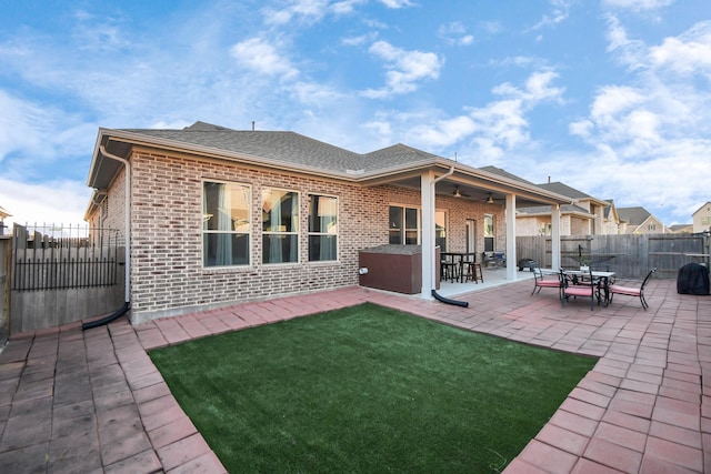 rear view of house featuring a patio and ceiling fan