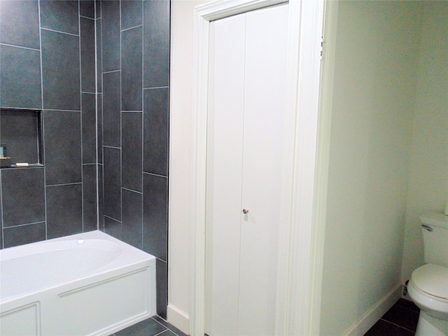 bathroom featuring tile patterned floors and toilet