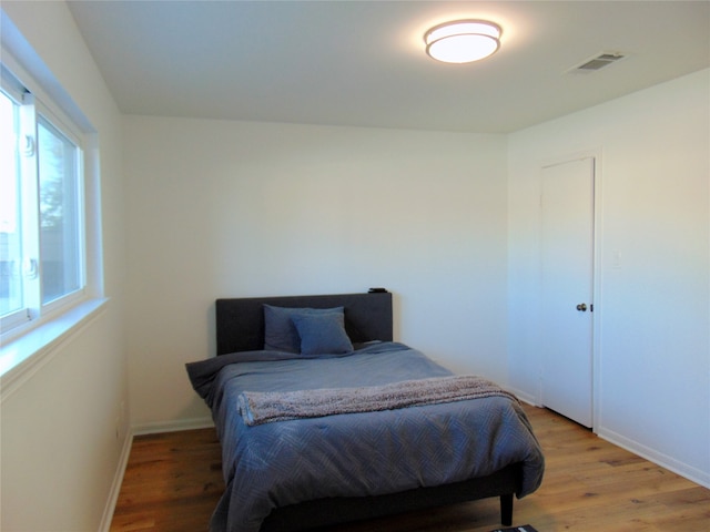 bedroom with light hardwood / wood-style floors