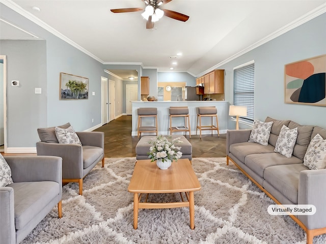 living room featuring ceiling fan and ornamental molding