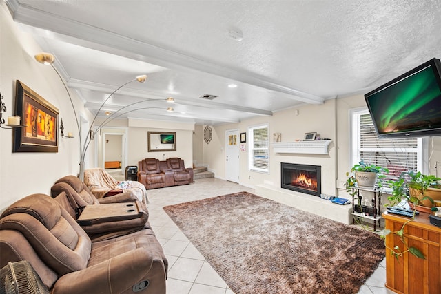 tiled living room featuring beam ceiling, a textured ceiling, and ornamental molding