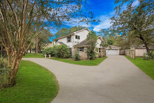 view of front facade with a garage and a front lawn