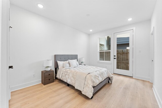 3109 Jensen Dr Unit B, Houston, TX 77026 - bedroom with access to exterior and light wood-type flooring