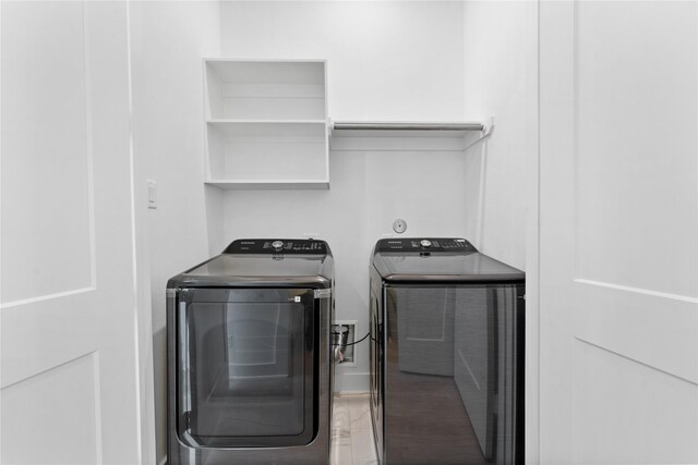 3109 Jensen Dr Unit B, Houston, TX 77026 - clothes washing area with washing machine and dryer