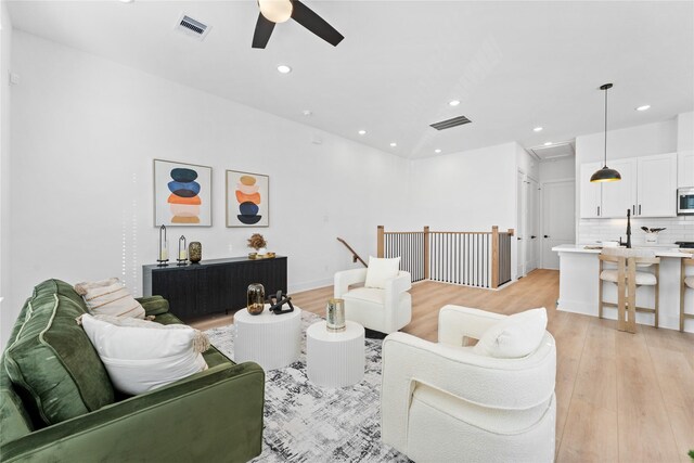 3109 Jensen Dr Unit B, Houston, TX 77026 - living room featuring light hardwood / wood-style flooring and ceiling fan