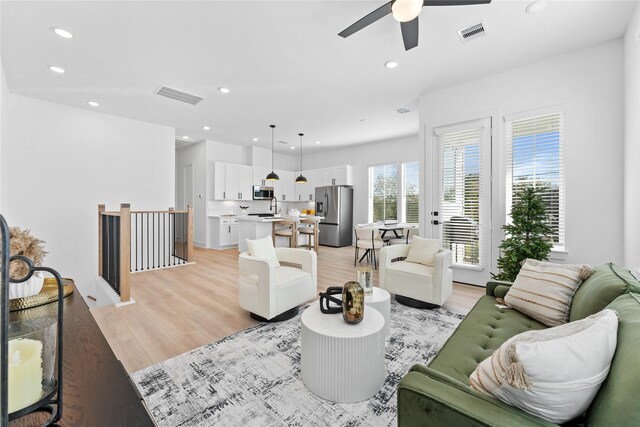 3109 Jensen Dr Unit B, Houston, TX 77026 - living room featuring ceiling fan and light hardwood / wood-style floors