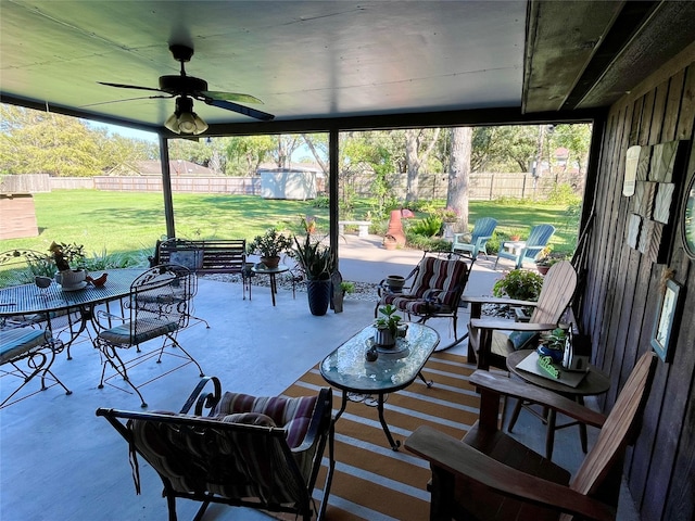 view of patio / terrace featuring ceiling fan and a storage shed