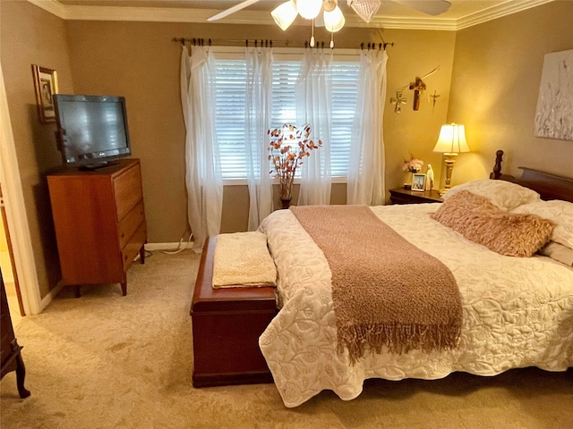 bedroom featuring ceiling fan, ornamental molding, and carpet floors