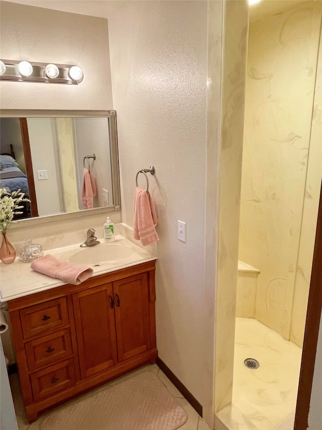 bathroom featuring vanity and a shower