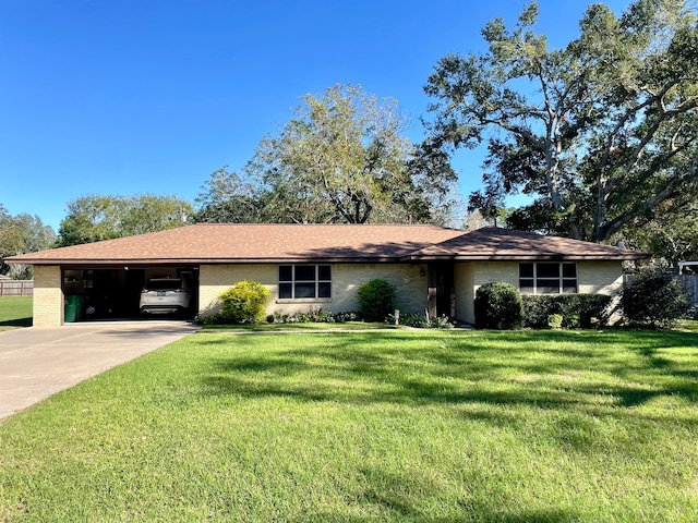 single story home featuring a carport and a front lawn