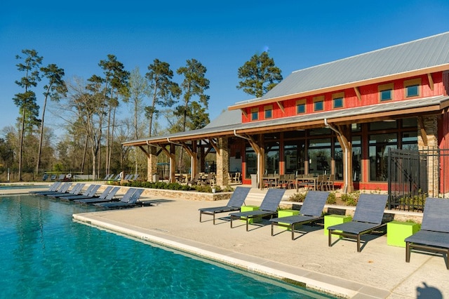 view of swimming pool with a patio area