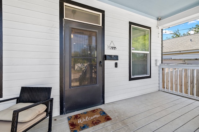 entrance to property featuring a porch