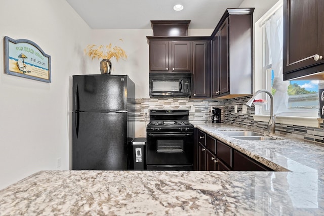 kitchen with black appliances, sink, decorative backsplash, light stone countertops, and dark brown cabinets