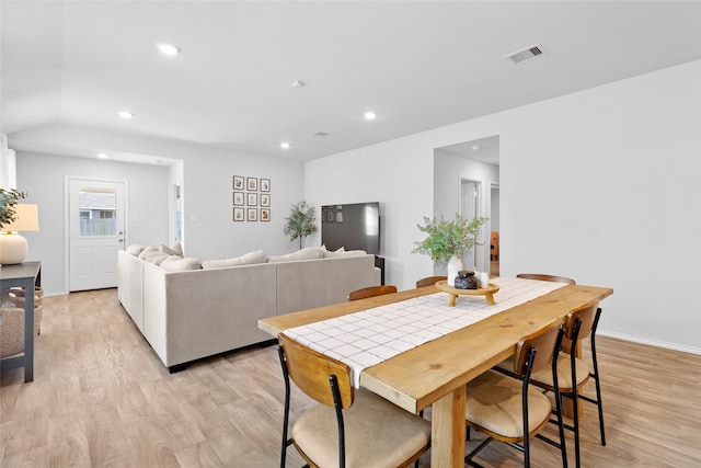 dining space with light hardwood / wood-style flooring