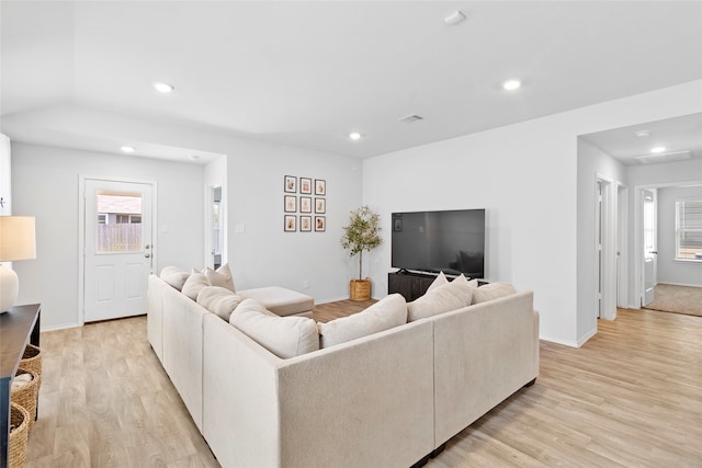 living room with light hardwood / wood-style flooring