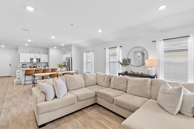 living room with light hardwood / wood-style floors