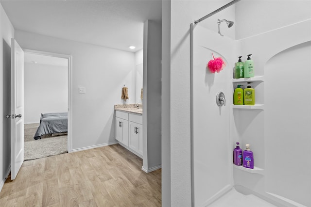 bathroom featuring vanity and wood-type flooring