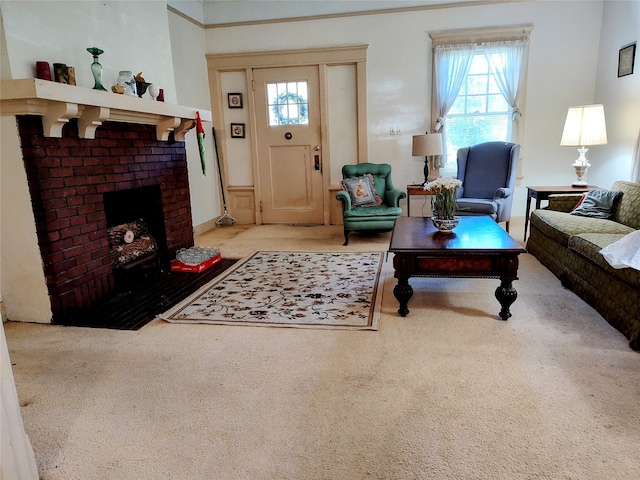 living room featuring carpet and a brick fireplace