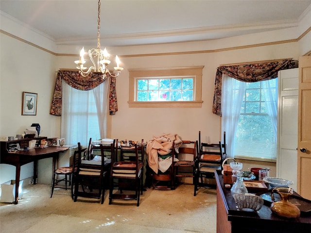 dining space featuring carpet floors, an inviting chandelier, and ornamental molding