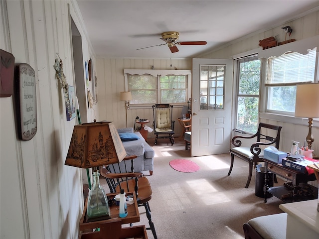 sitting room featuring carpet and ceiling fan