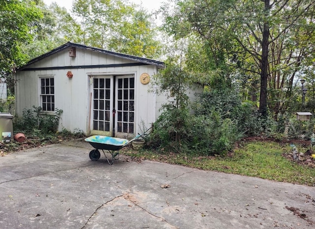 rear view of property featuring french doors and a patio