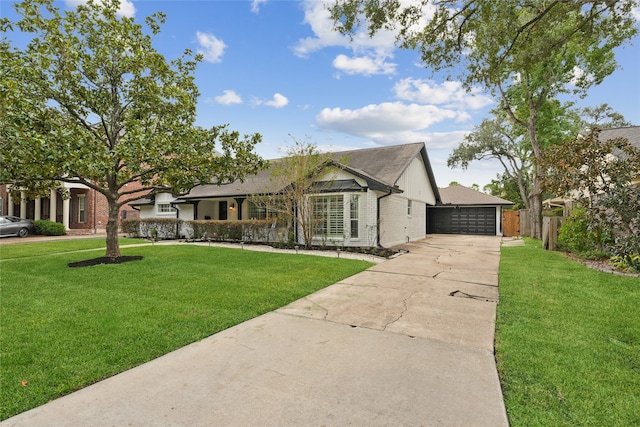 ranch-style house featuring a front yard and a garage