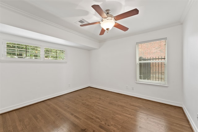 spare room featuring ceiling fan, wood-type flooring, and ornamental molding