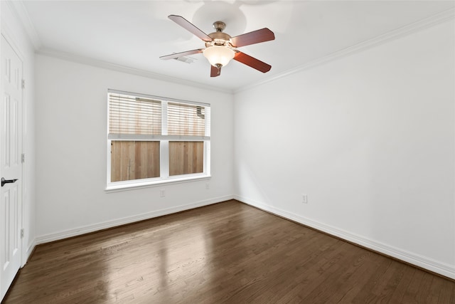 spare room featuring crown molding, ceiling fan, and dark wood-type flooring