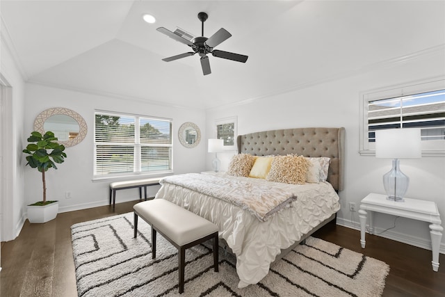 bedroom with dark hardwood / wood-style floors, ceiling fan, lofted ceiling, and crown molding