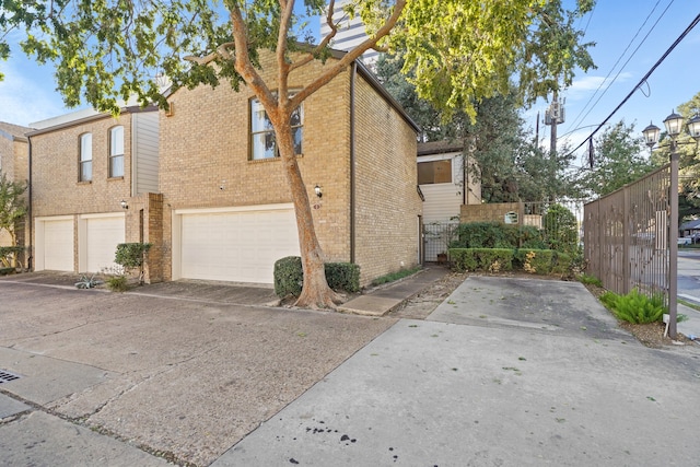 view of side of home featuring a garage