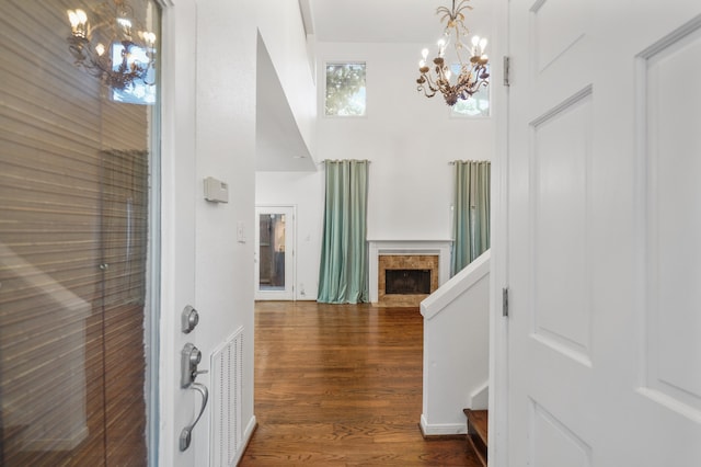 entrance foyer featuring a notable chandelier and dark hardwood / wood-style floors