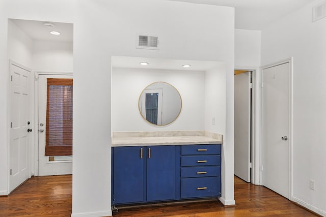 bathroom featuring vanity and hardwood / wood-style flooring