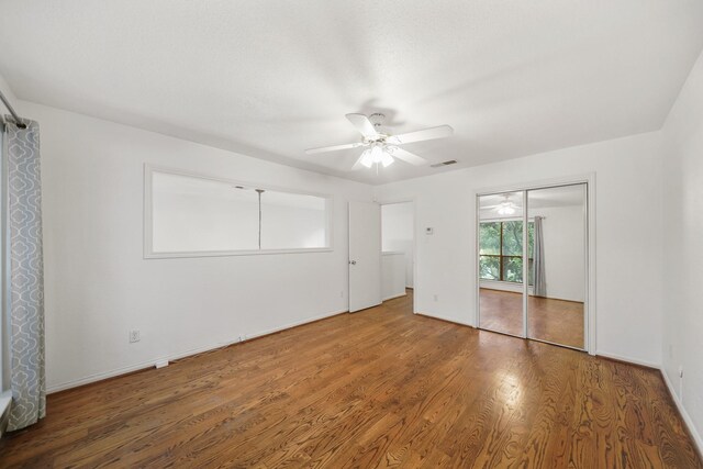 unfurnished bedroom featuring ceiling fan and wood-type flooring