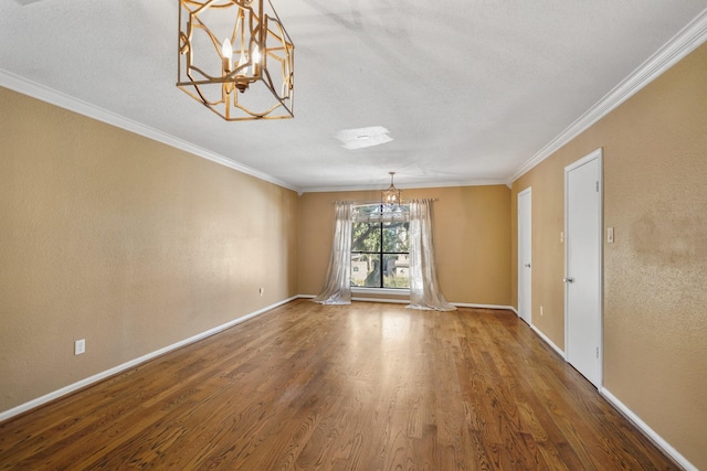 2555 Bering Dr Unit 1, Houston, TX 77057 - interior space with crown molding, baseboards, wood finished floors, and a notable chandelier