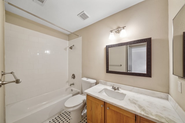 full bathroom with tile patterned flooring, vanity, toilet, and tiled shower / bath combo