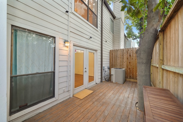 wooden deck with french doors and central AC unit