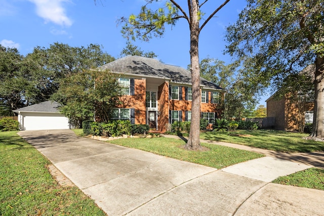 view of front of house with a garage and a front lawn