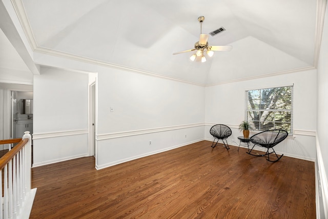 unfurnished room featuring dark hardwood / wood-style floors, ceiling fan, crown molding, and vaulted ceiling