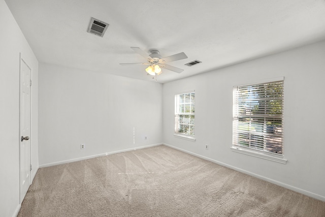 carpeted empty room with ceiling fan