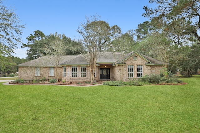 ranch-style home with a front lawn