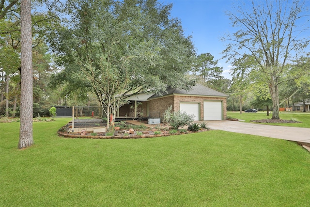 view of front of house featuring a front yard and a garage