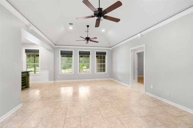 spare room featuring baseboards, vaulted ceiling, crown molding, and recessed lighting