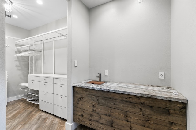 bathroom featuring vanity and hardwood / wood-style flooring