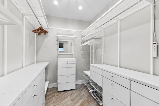 spacious closet featuring light hardwood / wood-style flooring