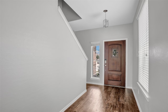 entryway with dark wood-type flooring